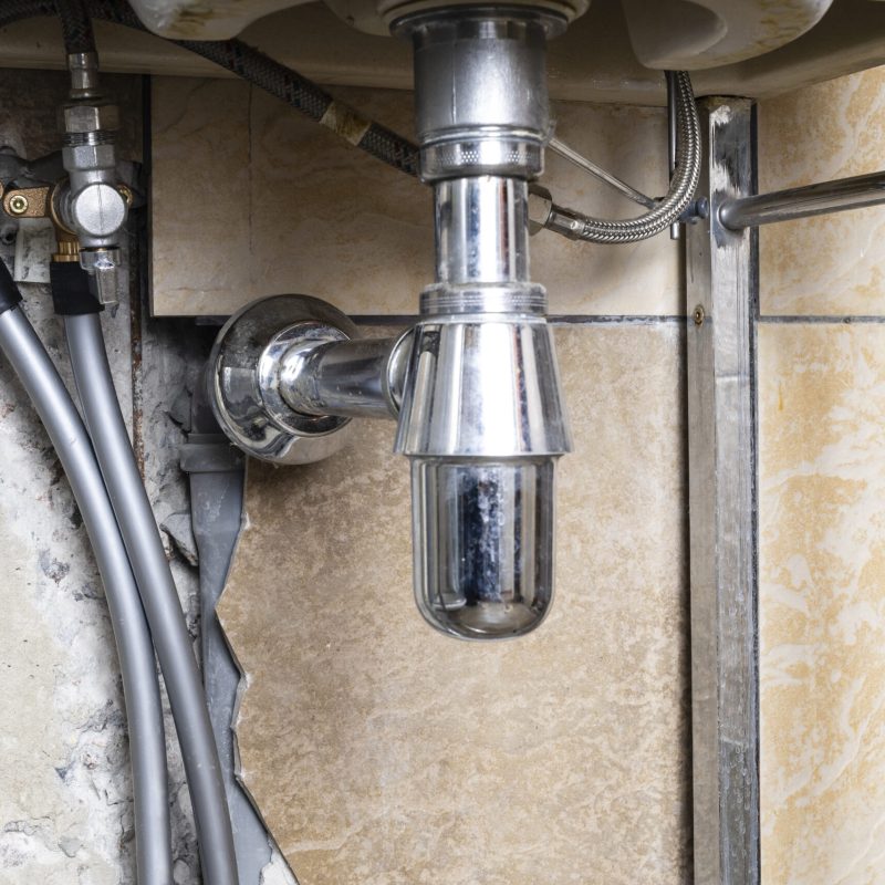 new high density polyethylene water pipes connected to valves of sink in home bathroom